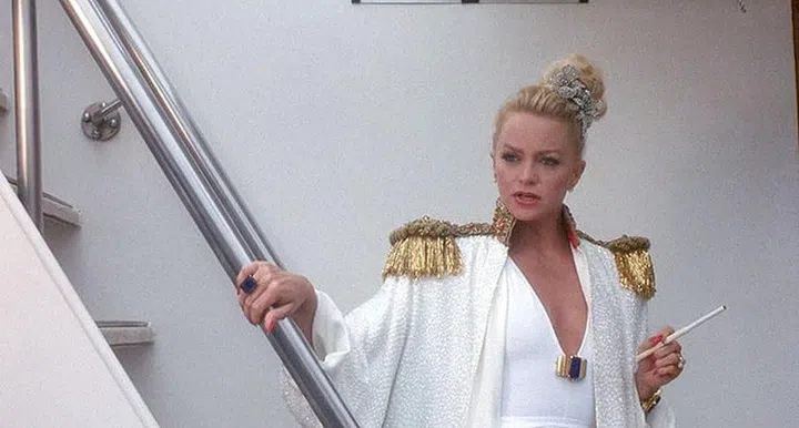 Before her amnesia and new life in Elk Cove, Oregon, the young heiress, played by Goldie Hawn, had the most glamorous yacht style—all stored in her famous cedar closet, of course.

Photo: Getty
