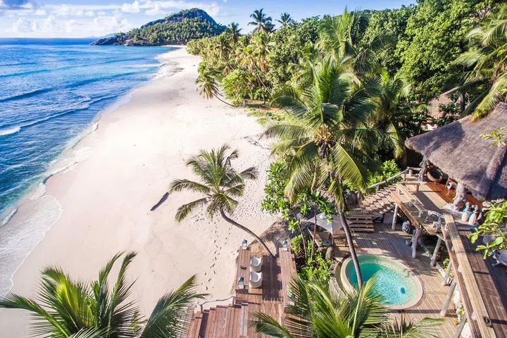 The staff at Black Tomato calls this place a "10 out of 10 in every way." Each of the villas at this resort in the Seychelles has been restored using local materials from the island, and every abode is assigned an attendant to bring you snacks, drinks, or whatever you'd like 24/7. This is the life.
