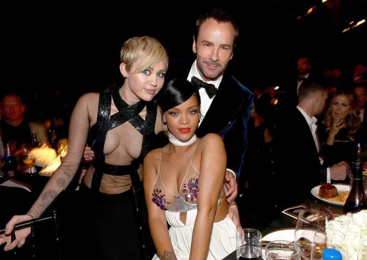 HOLLYWOOD, CA - OCTOBER 29:  (L-R) Recording artists Miley Cyrus, Rihanna and honoree Tom Ford attend amfAR LA Inspiration Gala honoring Tom Ford at Milk Studios on October 29, 2014 in Hollywood, California.  (Photo by Christopher Polk/Getty Images for amfAR)