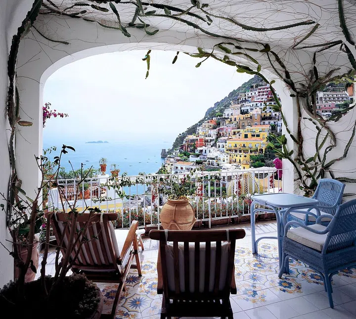 Ever wonder where those postcard Instagrams of Positano were shot? The ones with the cascading rainbow of villas, tiled church dome, and a yacht-dotted Mediterranean in the background? Chances are, they were taken from Le Sirenuse – one of the Amalfi Coast’s most gorgeous seaside resorts.

Poppy Delevingne, Sienna Miller, and Eddie Redmayne are just a few of the notable guests that have graced this hotel's vine-laced terrace, and Reese Witherspoon honeymooned here with her husband, Jim Toth, in 2011.