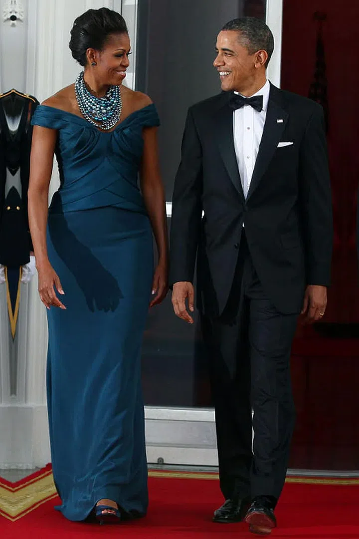 While Michelle Obama's navy, off-the-shoulder Marchesa gown is lovely, her statement necklace by Tom Binns definitely stole the show.