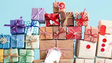 Collection of Christmas present boxes on a light blue background