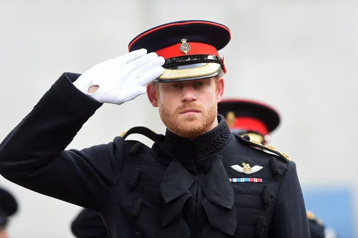 Prince Harry, 32, marches in the Fields of Remembrance ceremony.