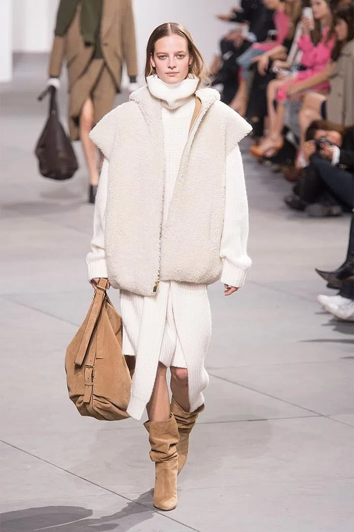 It's apparently time to lighten up—with winter whites as far as the eye can see, all artfully layered on everything from gowns to robe coats and shearlings .
Pictured: Michael Kors 