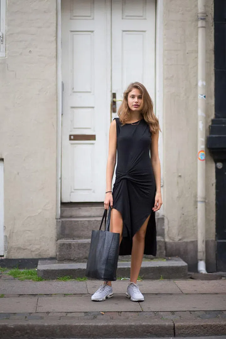A little black dress looks just as classic with a pair of Nike sneakers.Photo: Diego Zuko 