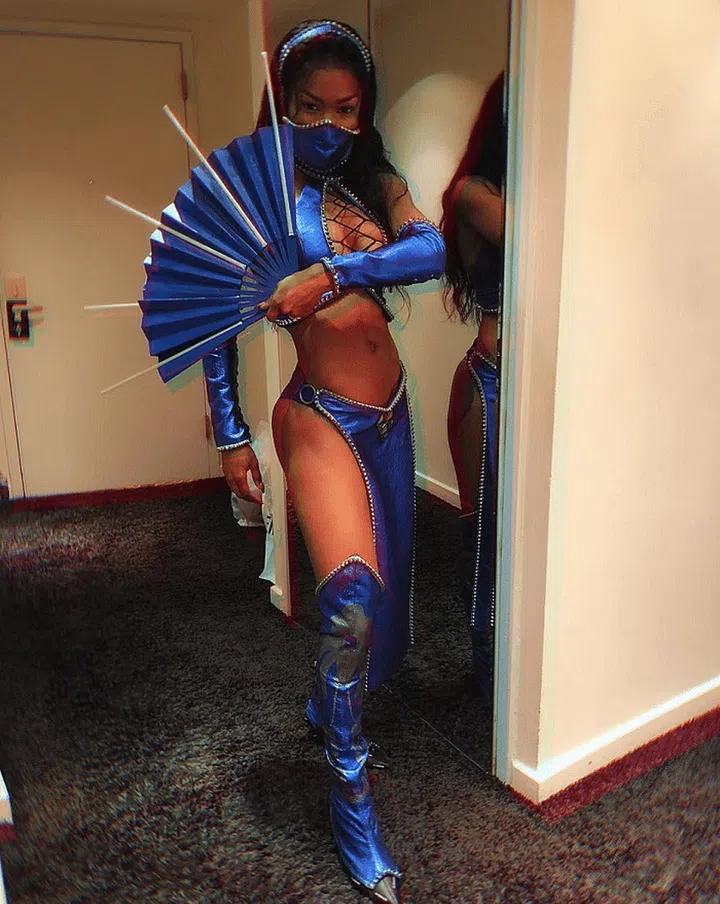 As Kitana from Mortal Kombat.