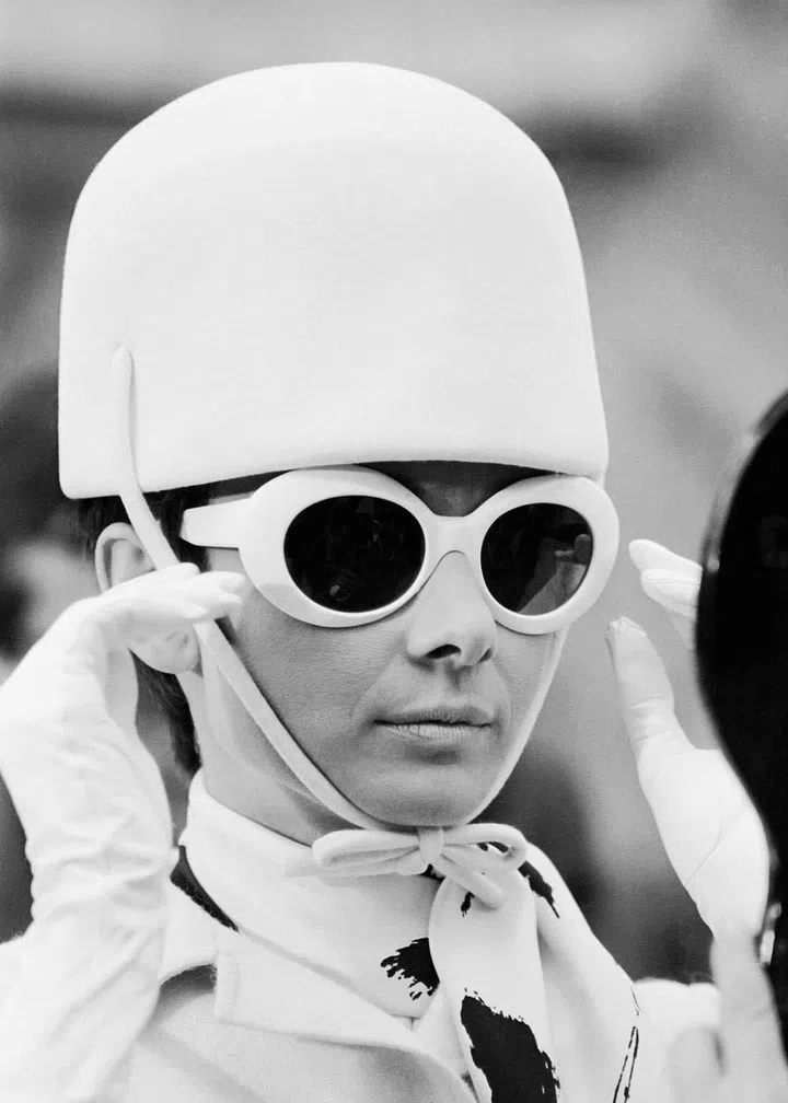A space age Mod look comprising riding hat and sunglasses in striking white.