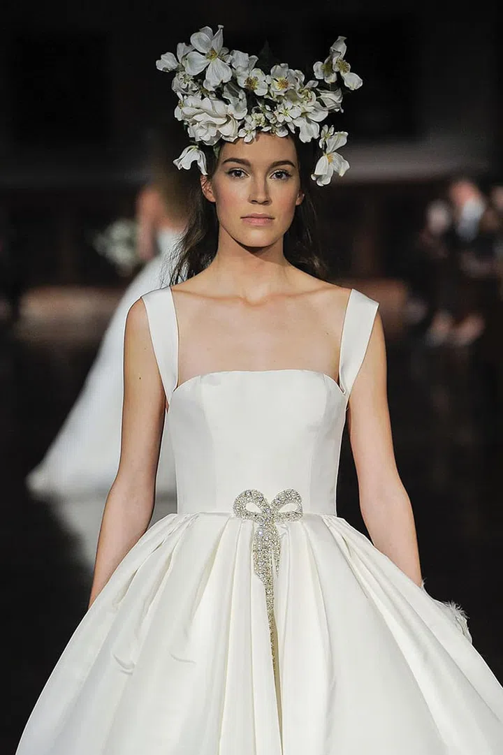 A floral headpiece this extravagant is only for the boldest brides, but take from it this: instead of wearing a single flower or glittery pin in your hair, consider adding more.