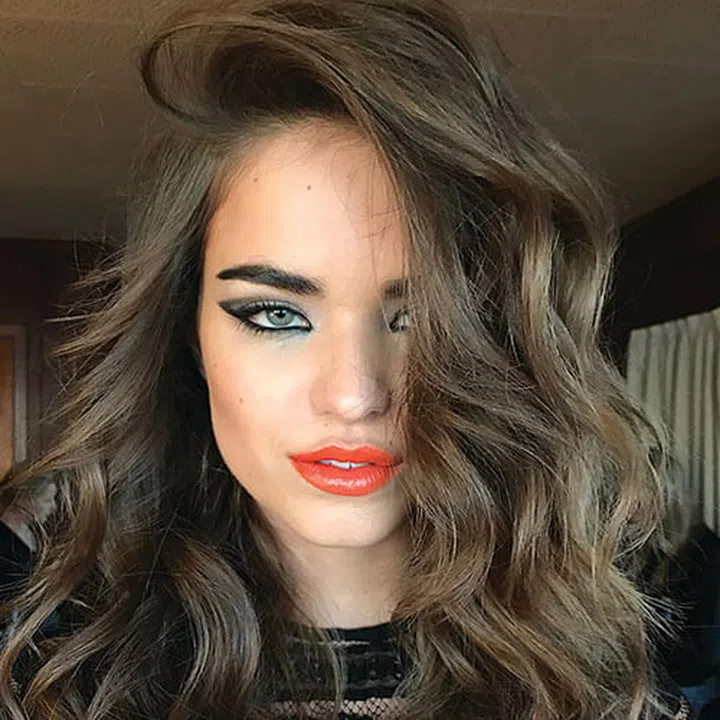 When the model took a selfie with your iPhone. She just couldn't resist the good light, good hair, good makeup combo.