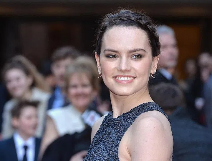 For a more bohemian vibe, braid a small piece of your hair around the hairline. Secure it with bobby pins behind your ears. Lastly, gather the rest of your hair into a low bun. 

Photo: Getty Images