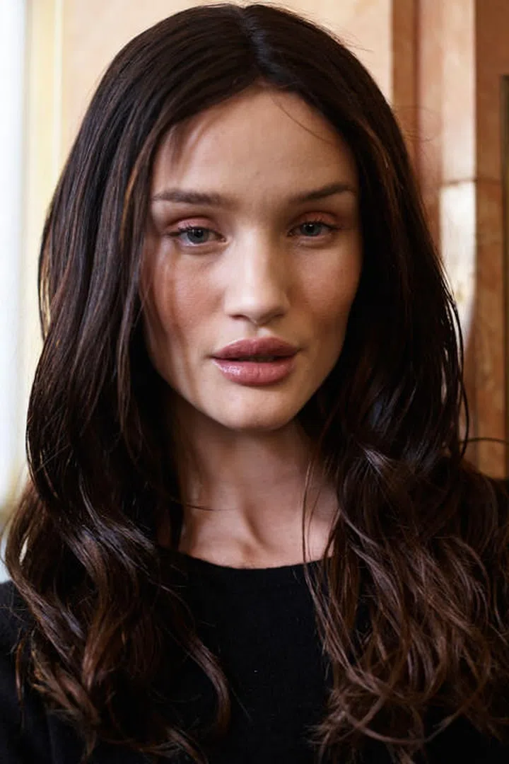 The style: Rosie Huntington-Whiteley took to the catwalk in a long brunette wig for Balmain. Photo: Getty 