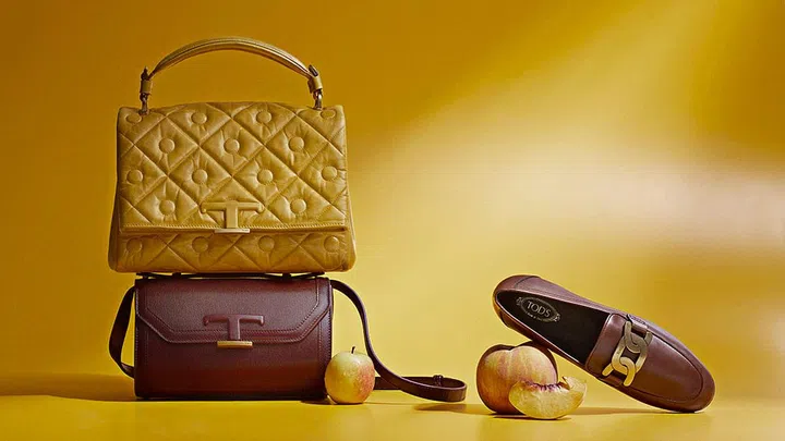 (Left to right) Tod’s Signature Bag in Yellow, S$3,020; Tod’s T Timeless Bag in Burgundy S$2,270; Tod’s Kate Mocassino, S$1,100.