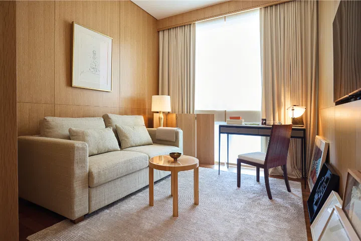 The TV room featuring an Alberto Giacometti artwork and Jean-Michel Frank marquetry table by Hermès.