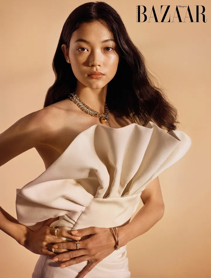 Bustier dress, Celine by Hedi Slimane. Warrings, necklaces, bracelet (worn as necklace), bracelet, and rings, Tiffany & Co.