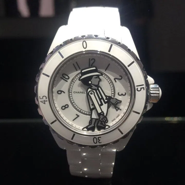 Let Coco Chanel tell you the time with her swinging arms