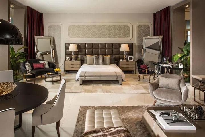 Cary Fernandez paired with Dolce & Gabbana for her first appearance at the Design House, and created a bedroom concept revolving around deep maroons and beiges. Curvy arrangements and leather pieces help to exude D&G's authentic elegance.