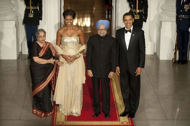 The Obamas pose with Indian Prime Minister Dr. Manmohan Singh and Mrs. Gursharan Kaur to the White House.