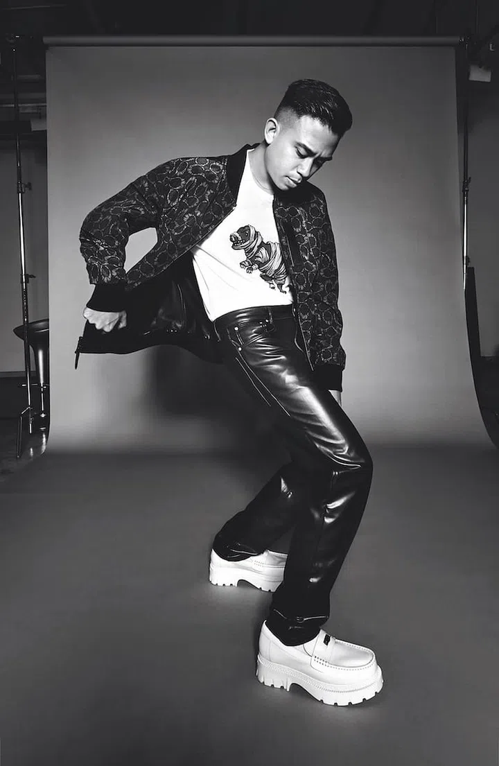 Alyph wears jacket and t-shirt, both by Coach
x Michael B. Jordan. Shoes, by Coach. Trousers, Alyph’s own. Socks, stylist’s own. (Phot0: Cher Him)
