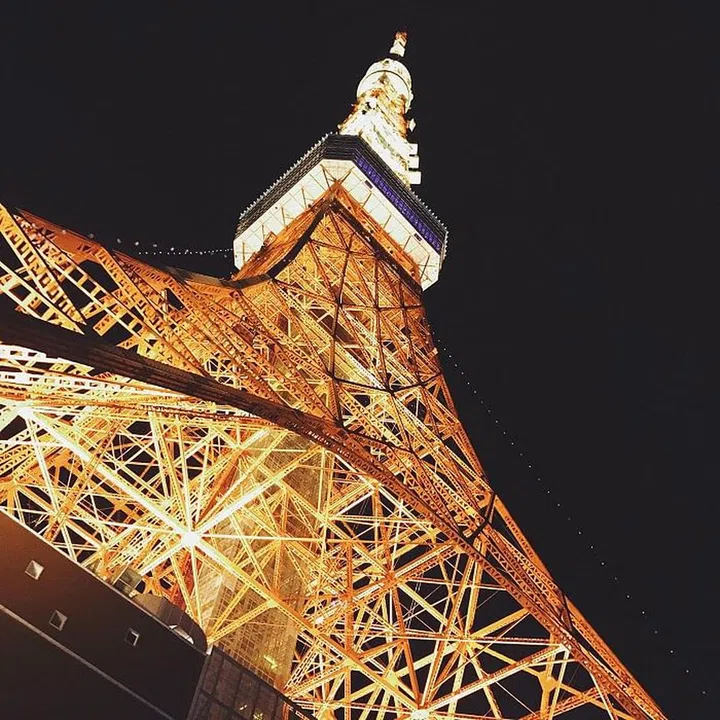 Tokyo Tower bathed in an orange glow