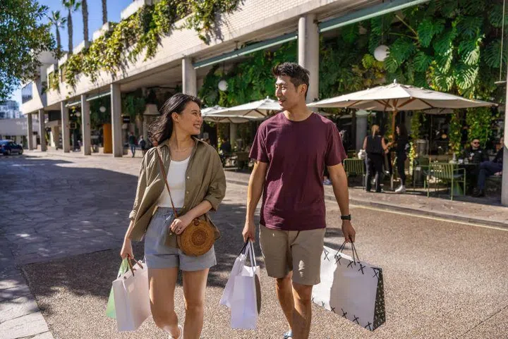 Asian couple shopping at Brisbane’s James Street, Australia