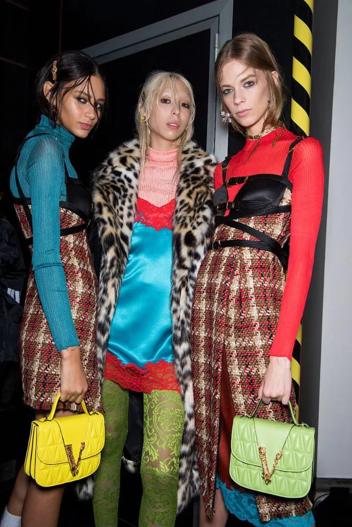 Our collective cultural nostalgia for everything ’90s has brought grunge back to the forefront of the fashion conversation, though Donatella Versace is
probably the last designer you’d expect to take on the thrift-store aesthetic. Of course, with Versace being the house of gilt and glitz, Donatella’s take on grunge came underpinned with a heavy dose of glamour. There were more furs than there were flannels, and the haphazard layers of the Courtney Love look here were composed of silks and crystal mesh. Holey knits were pierced with giant gold safety-pins—an ingenious way to update a house signature and believably work it into the collection. Leather harnesses added another distinctively Versace touch. The parts of the collection that pivoted back into full-on glam—the bronze crystal mesh column, the croc-stamped slip, the slinky black gown that closed the show—were equally compelling.