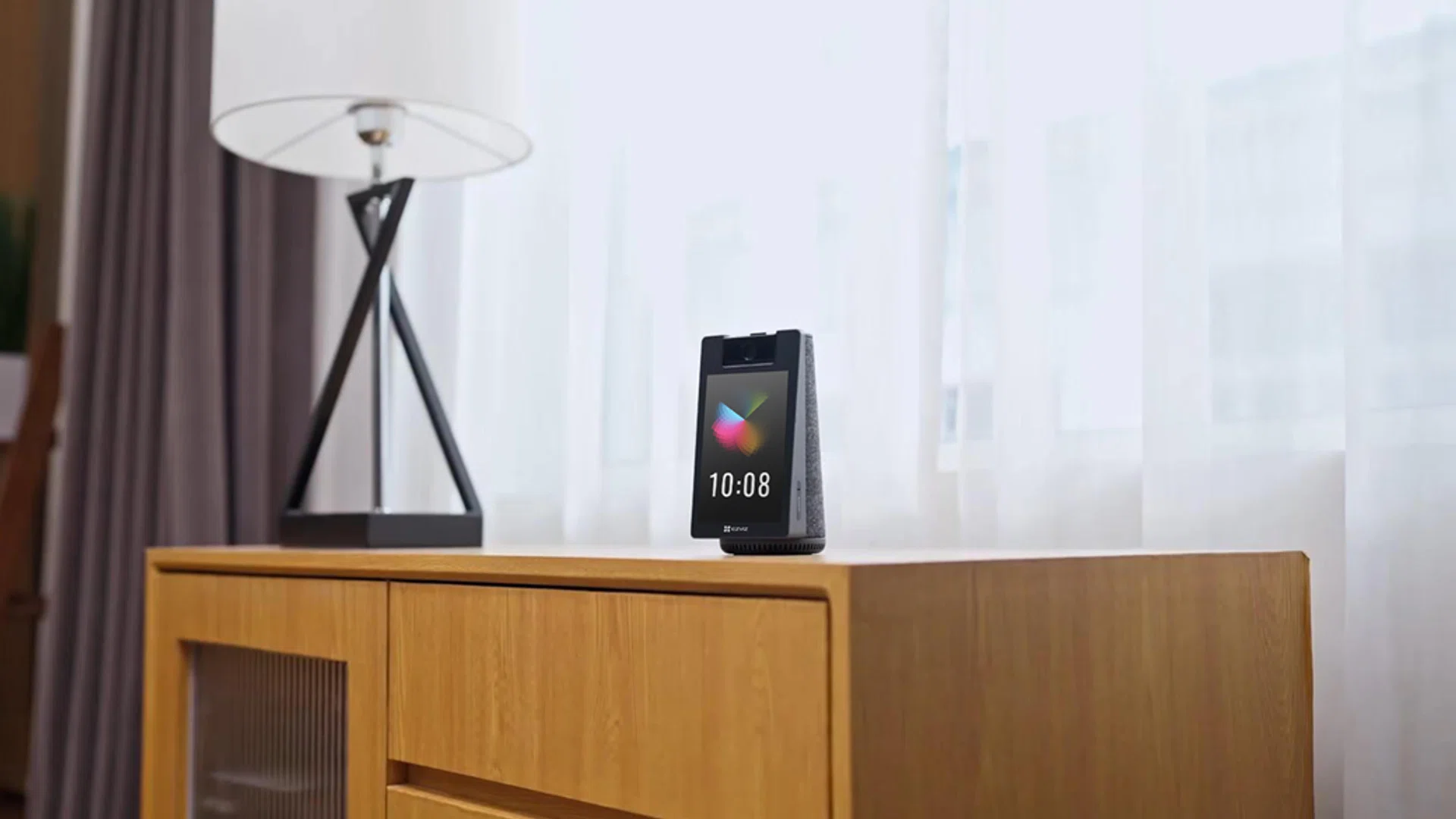 ezviz s10 smart home camera on a wooden cabinet in a modern living room