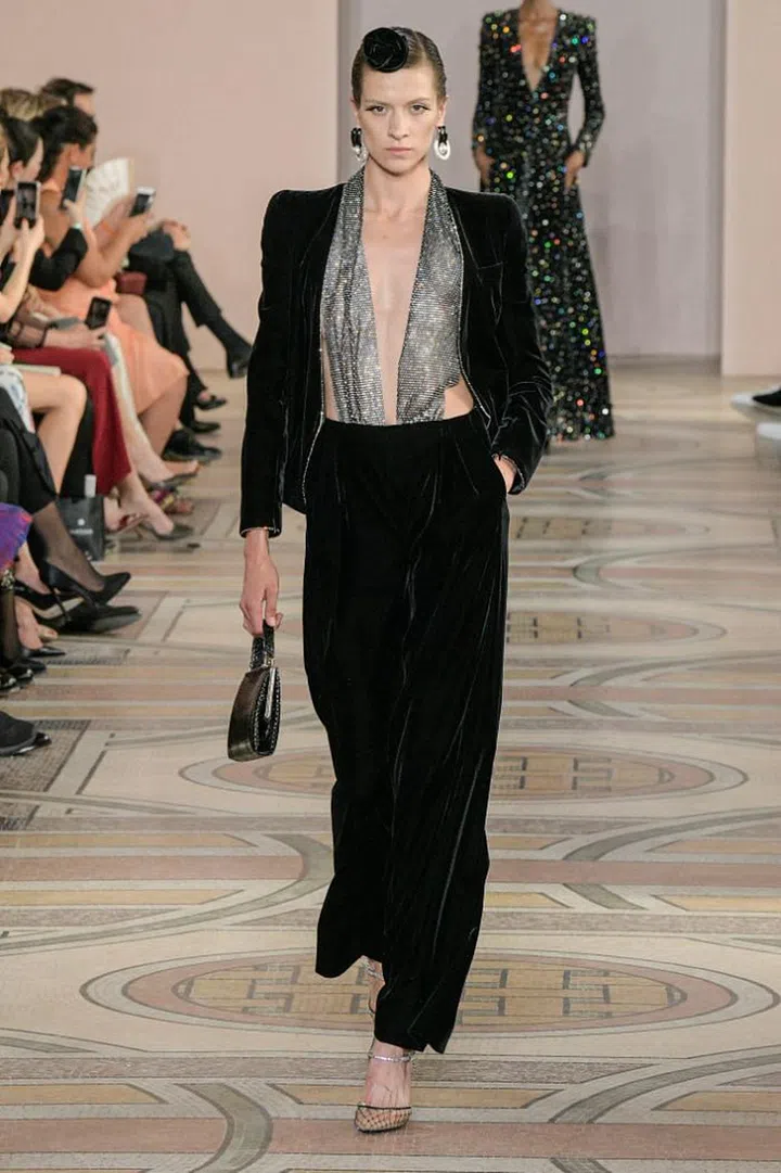 Mr Armani is a lifelong fan of film, with movies serving as a form of escape during his war-ravaged childhood. It’s fitting, then, that his latest Armani Privé collection was a tribute to Hollywood’s Golden Age. His opening section of slim, tailored jackets atop trousers that swished and shimmered dripped with 1930s Marlene Dietrich glamour. Like Hollywood’s shift from black and white to colour, the show started in monochrome before blossoming into pastels. The shapes, too, got more relaxed, softening into frothier fare such as chiff on tiers, flounced hems and candy-coloured furs. Armani then segued back to black for the finale, but, far from being basic, the creations were intensely embellished to evoke stars in the night sky. Real-life Tinseltown stars are sure to flock to them in droves.

Photo: Courtesy