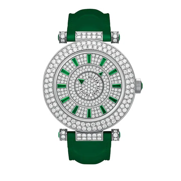 Franck Muller constantly surprises with its exquisite complications and use of bold colours. The white gold Double Mystery hypnotises with its diamond studded case and dial set with emerald hour and minute  indicators, while still maintaining an elegant simplicity with its circular silhouette.