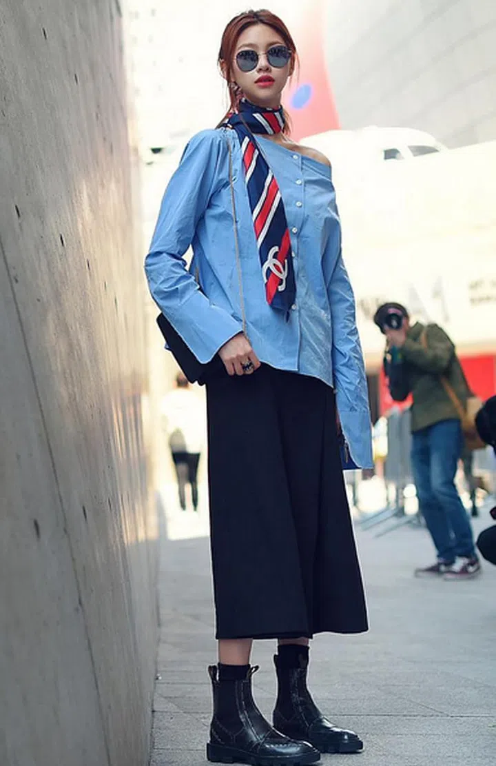 When it comes to looking smart in the office, detach yourself from the flock. Opt for a collarless off-shoulder shirt and pair it with a silk scarf twisted into a tie for an extra oomph. Photo: Instagram/@realstreet1