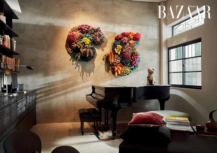 The coral-inspired artwork of Indonesian artist Mulyana adds a burst of colour and texture in the living room.