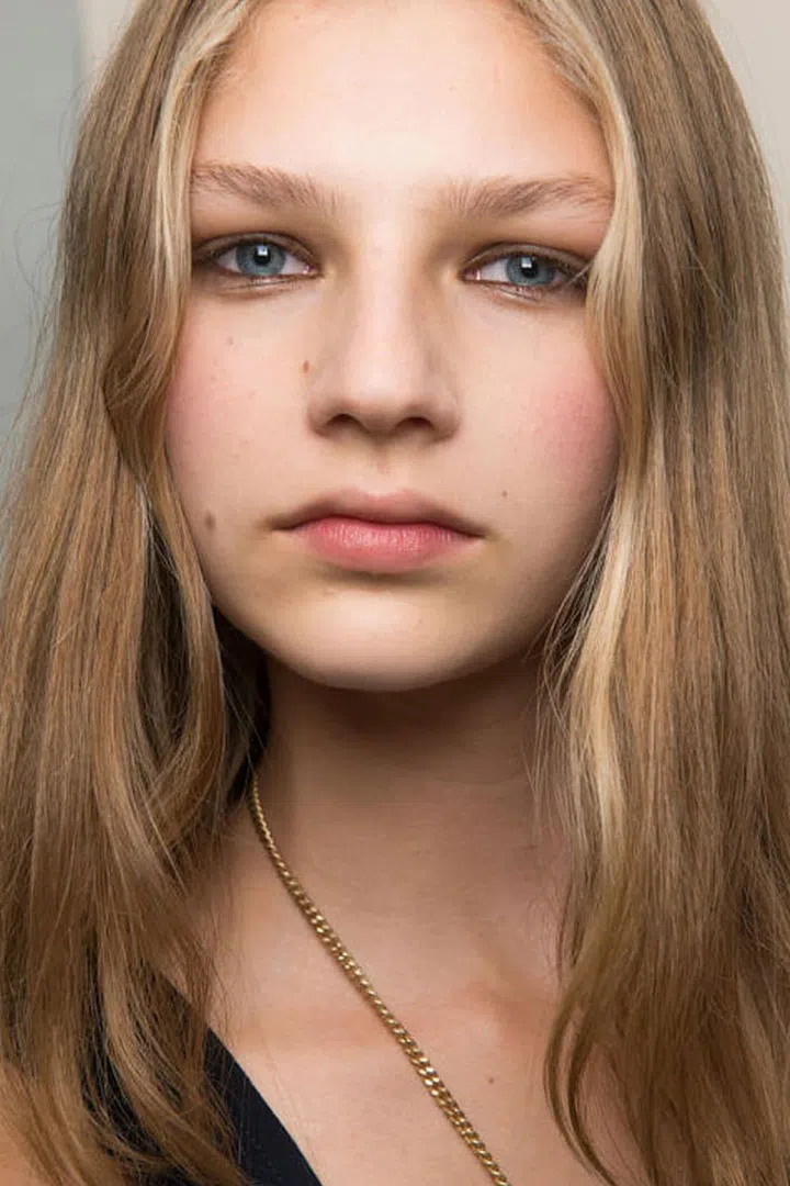 At Chloe, makeup artists used a mix of black eyeliner and silver eyeshadow to create the lighter version of a smoky eye.