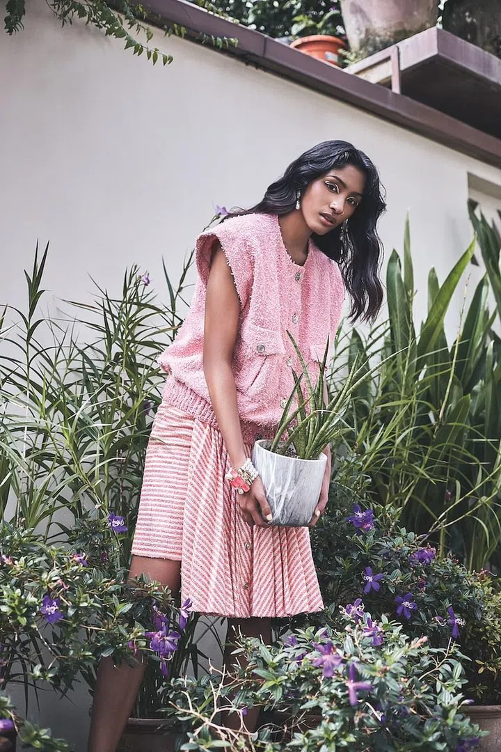 Top; skirt; earrings; cuff, Chanel. (Photo: Phyllicia Wang)