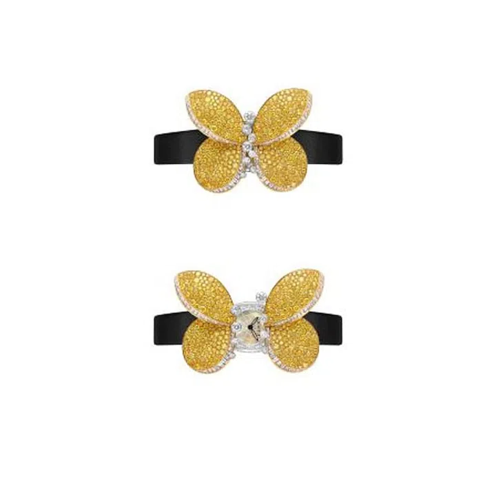 Designed using 3-D printing technology, the wings of the Princess Butterfly from Graff open seamlessly to reveal a secret 17 mm mother-of-pearl watch. It takes 366 yellow diamonds and 235 white diamonds to create the winged insect, with alternate versions available in white, pink, or yellow diamonds. You can also choose between satin straps or diamond bracelets.
Price Upon Request. graffdiamonds.com