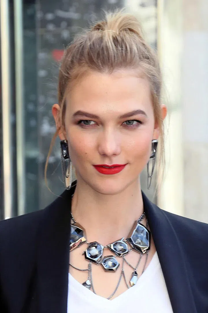 The model's major jewelry moment at a Swarovski event required a lipstick that could hold its own, and her fire engine shade definitely did the trick.
