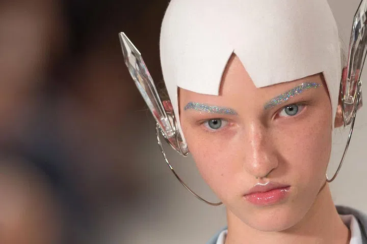 Other models at Maison Martin Margiela had their eyebrows covered in a blue-glitter pigment to lend a futuristic vibe.