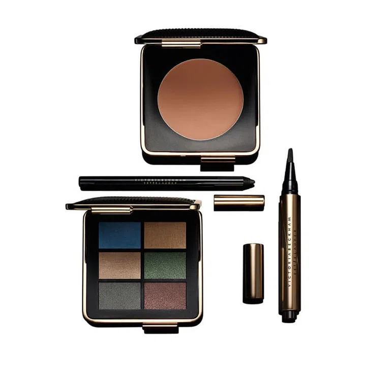 Clockwise from top center:
Victoria Beckham Estée Lauder Bronzer in Java Sun ($65)
Victoria Beckham Estée Lauder Lip Gloss in Moroccan Heat ($36)
Victoria Beckham Estée Lauder Eye Palette ($95) Six smoking hot shades, from lush sapphire to no-nonsense concrete.
Victoria Beckham Estée Lauder Lip Pencil in Victoria ($30) The third and final cornerstone product of the VB nude lip trifecta.

Photo: Estée Lauder
