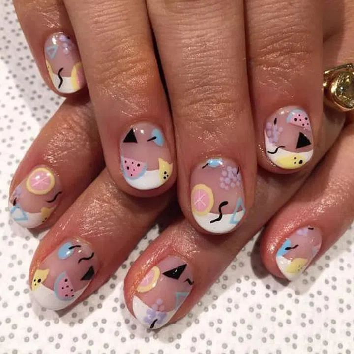 For a quirkier french tip, freehand your design allover like this mash up of grapefruits, watermelons, and '80s motifs. 
Design by @nailsbymii for @vanityprojects
