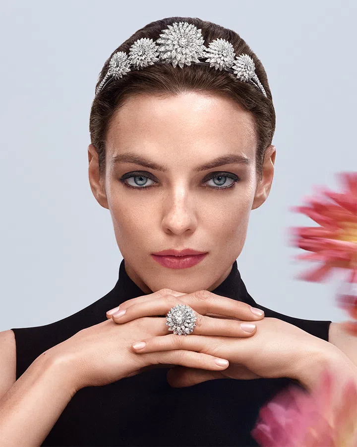 A model in black showing off Chaumet’s Jewels by Nature diamond dahlia tiara ring
