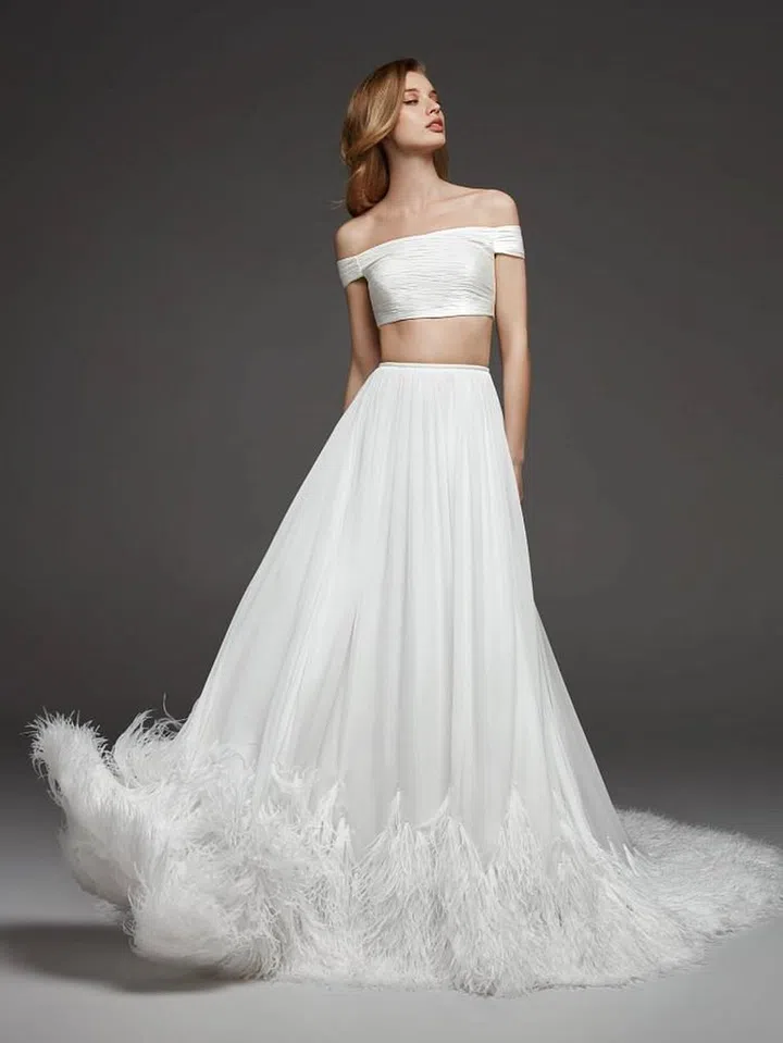 Get ready to bare those midriffs.  Separates made a splash on the runway with tiny crop tops and elegant matching skirts, such as in Vera Wang, Cushnie, Rime Arodaky, and Pronovias.