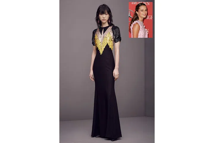 Vikander does everything from edgy, when she partners up with Louis Vuitton, to classic, when she turns to Victoria Beckham and Rosetta Getty. This Altuzarra gown offers a bit of both—with its streamlined silhouette and colored-blocked paillettes ; Photo: Courtesy of Altuzarra/Getty