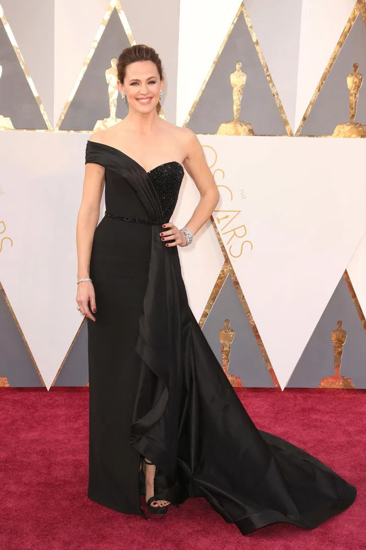 In custom Atelier Versace gown