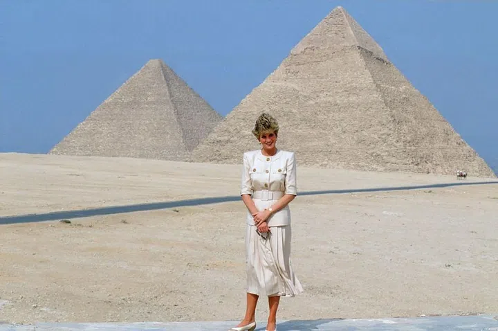 Visiting the pyramids of Giza in Egypt.

