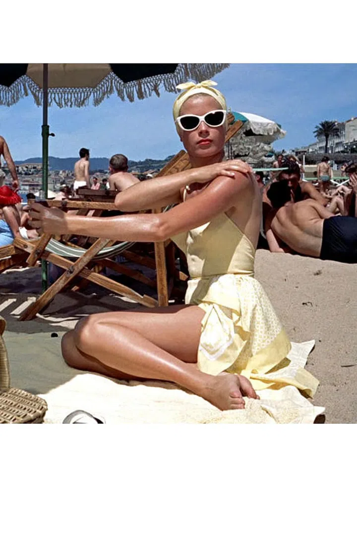 Cat-eye sunglasses + a scarf tied as a headband = the perfect accessory equation for a beach moment on level with Grace Kelly in To Catch A Thief.