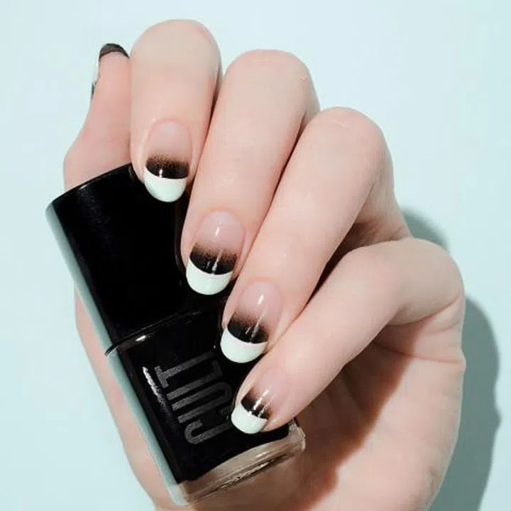This nail artist combined a mint french tip with an ombre fade. No matter what colors you choose, always start with your lightest shade first and give yourself ample time for each coat to dry. 
Design by @palemoonseattle