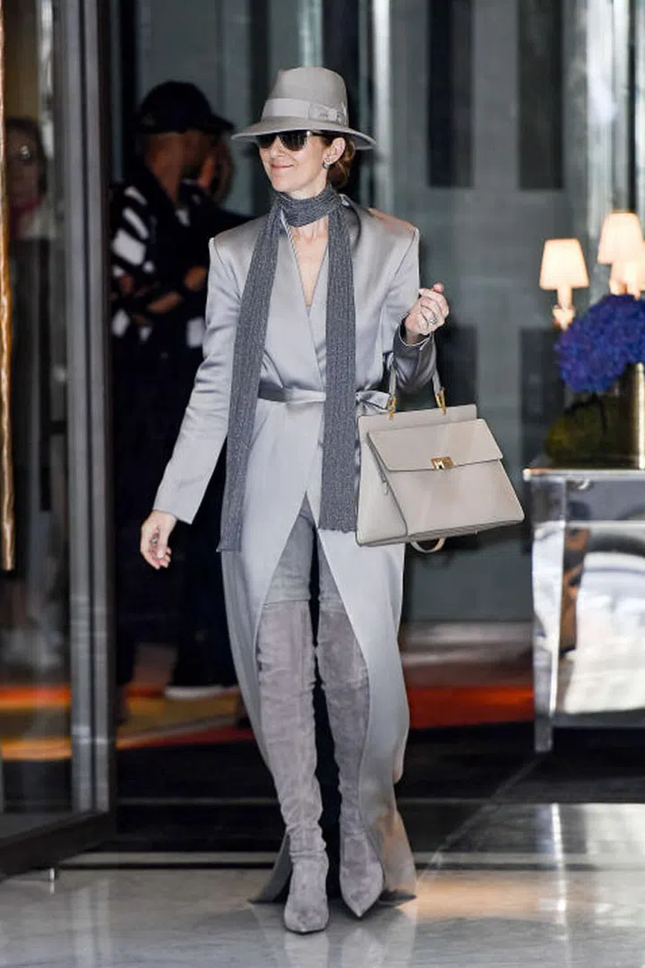 In a Balmain coat and pants, Le Silla boots and Ugo Mozie hat and scarf in Paris.
Photo: Splash
