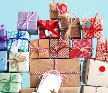 Collection of Christmas present boxes on a light blue background