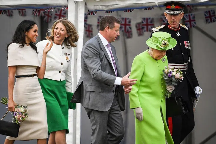 The royals chat with their hosts ahead of the day's first event. Photo: Getty