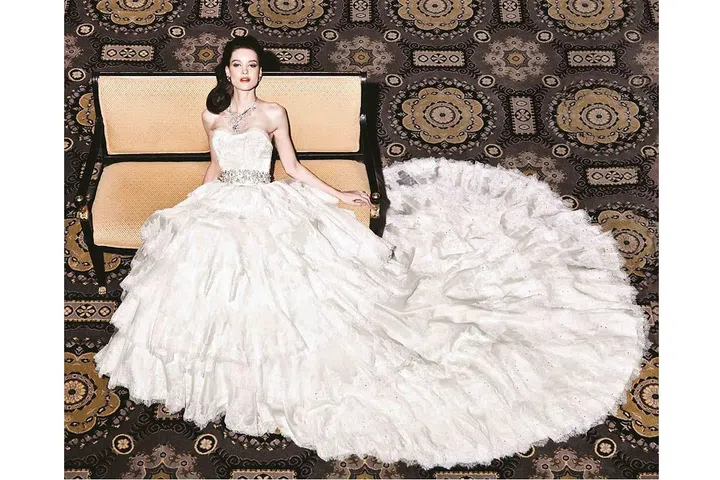 The designer Yumi Katsura's bejewelled dress is valued at a whopping £5 million and features a rare 5-carat white gold diamond, an 8.8-carat green diamond and a thousand pearls. Sadly, there's yet to be a bride brave enough to wear it. Photo: Yumi Katsura 