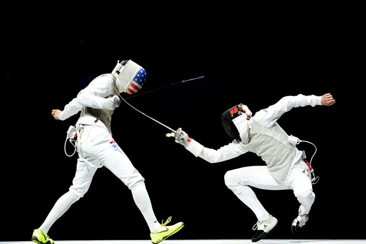 Alexander Massialias of the United States vs. Sebastian Bachmann of Germany in fencing. Photo: Getty