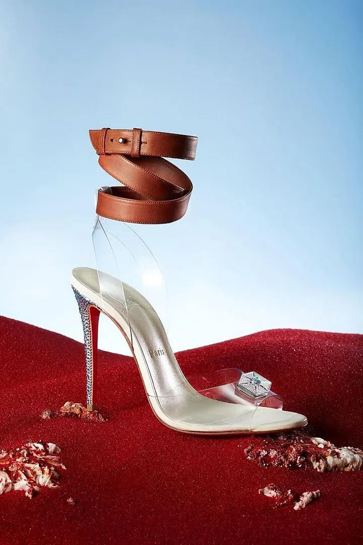 This shoe, fashioned after Rey (Daisy Ridley), features a leather wrap ankle strap inspired by the belt on her costume. The translucent straps are a nod to "her Jedi powers and the Force she embodies," the brand said in a statement. The tiny blue brass hue on the heel is a tribute to her lightsaber. Photo: Guillaume Fandel